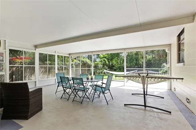 a view of yard with swimming pool and sitting area