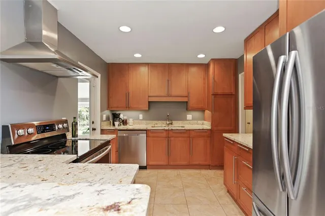 a stove top oven sitting inside of a kitchen