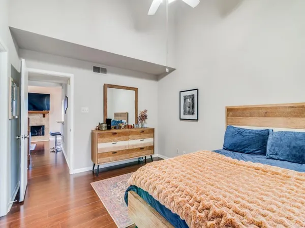 a bedroom with a bed and a dresser