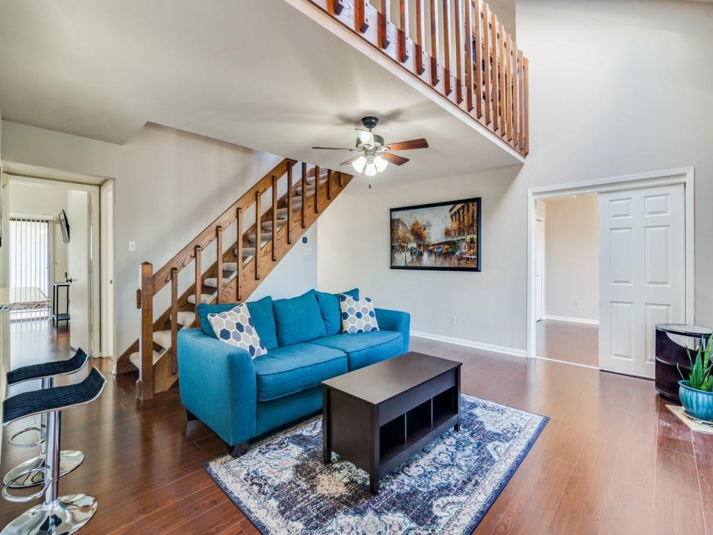1028 Signal Ridge Place Rockwall, TX 75032 - Photo 4 of 27 a living room with furniture and a rug