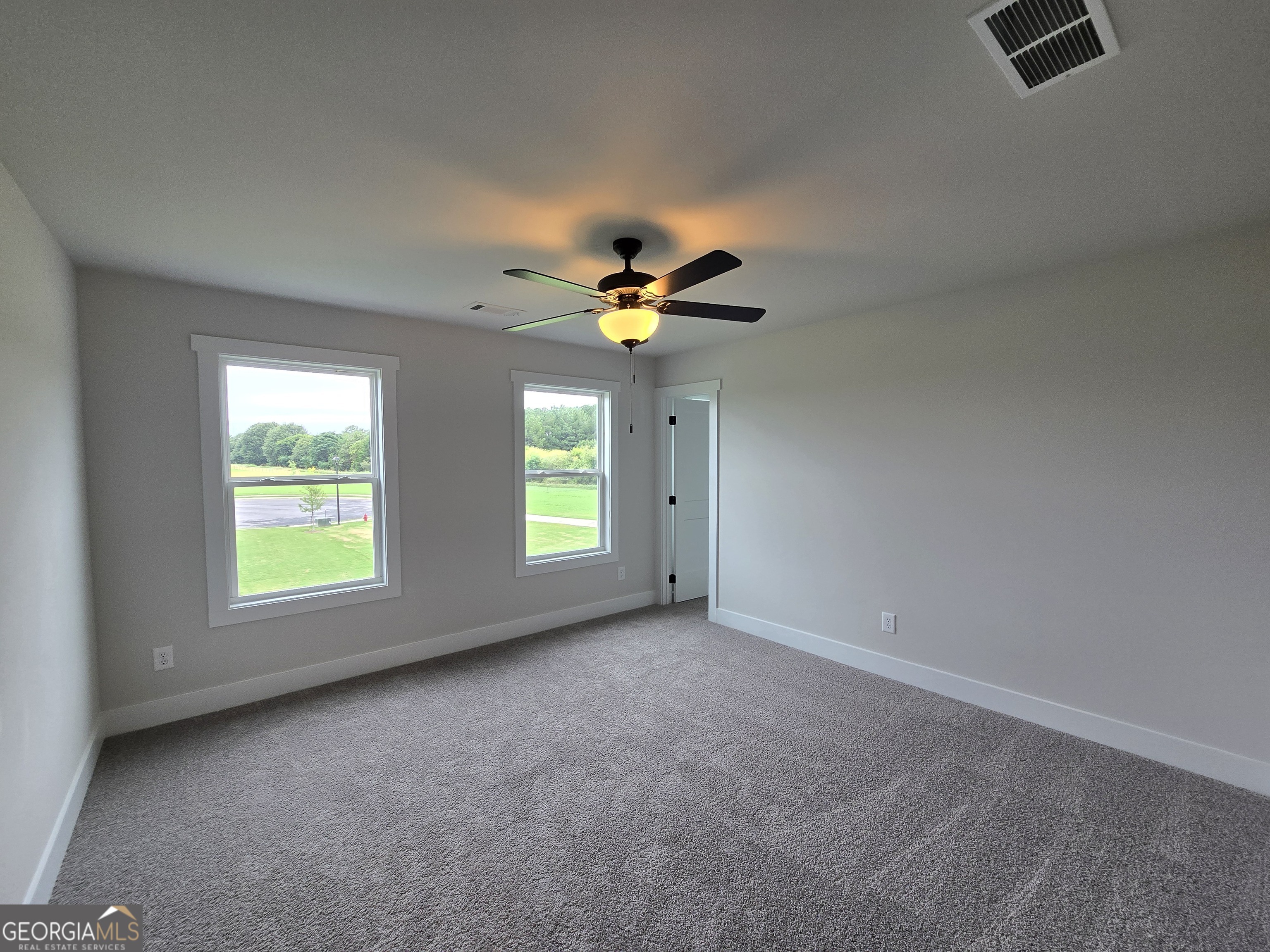 1041 Alaina Avenue, Unit 69 Madison, GA 30650 - Photo 15 of 20 a view of workspace with window and ceiling fan