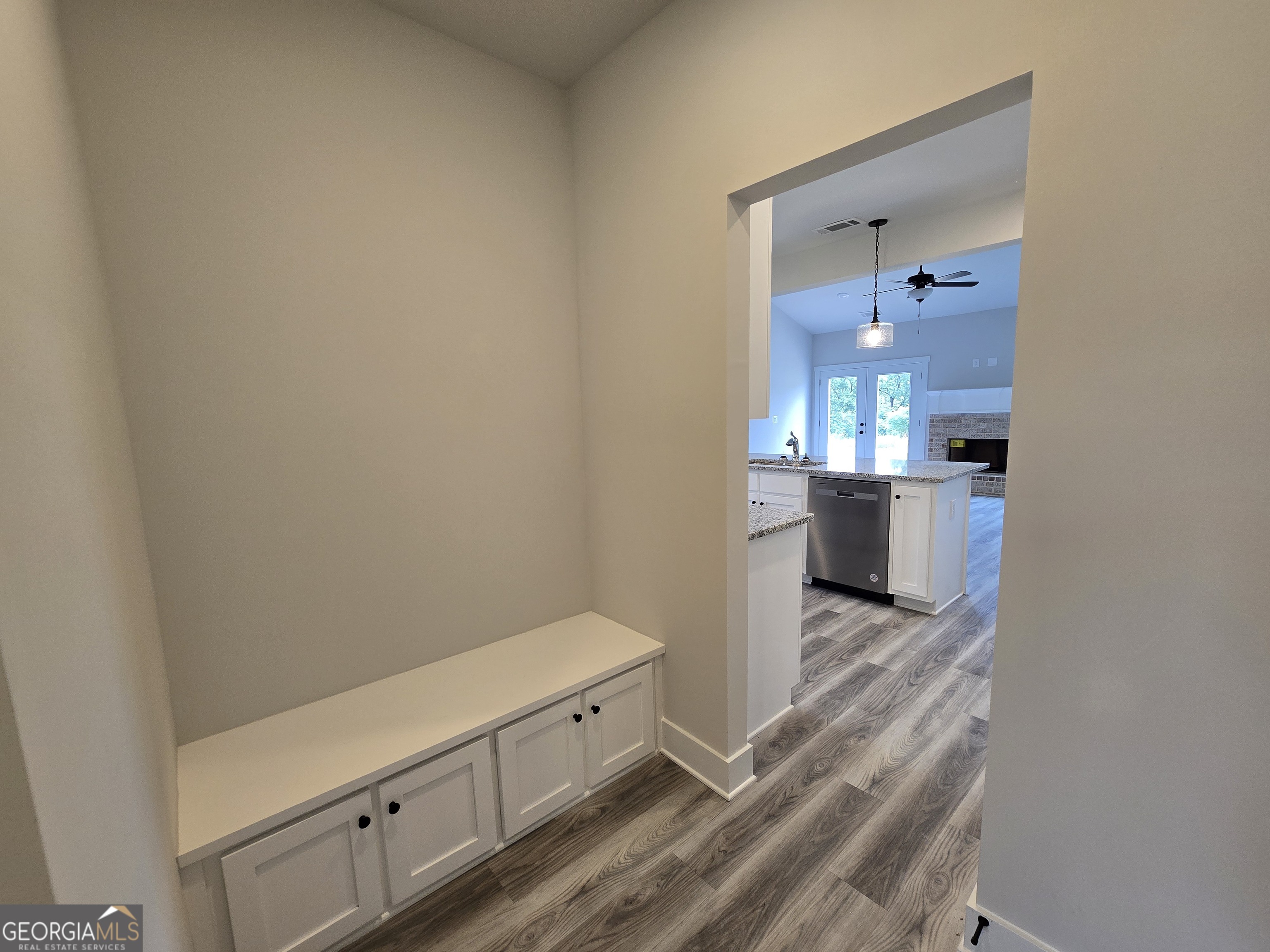 1041 Alaina Avenue, Unit 69 Madison, GA 30650 - Photo 10 of 20 a room with a dresser and a mirror