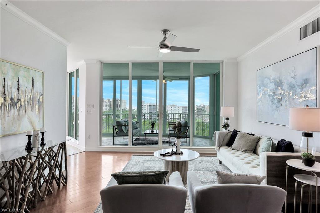 300 Dunes Boulevard, Unit 605 Naples, FL 34110 - Photo 1 of 37 a living room with furniture and a large window