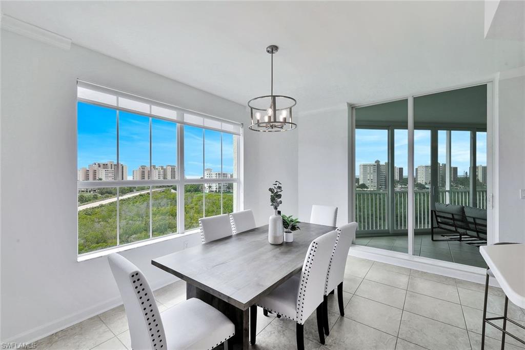 300 Dunes Boulevard, Unit 605 Naples, FL 34110 - Photo 11 of 37 a view of a dining room with furniture window and outside view