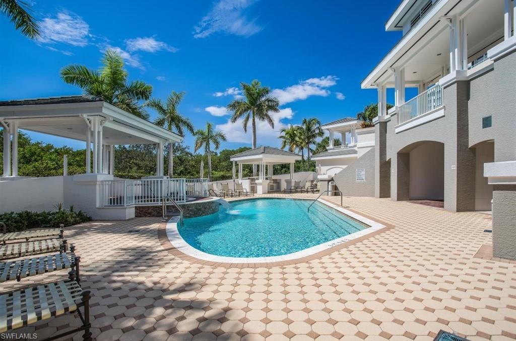 300 Dunes Boulevard, Unit 605 Naples, FL 34110 - Photo 24 of 37 a view of outdoor space yard deck patio and swimming pool