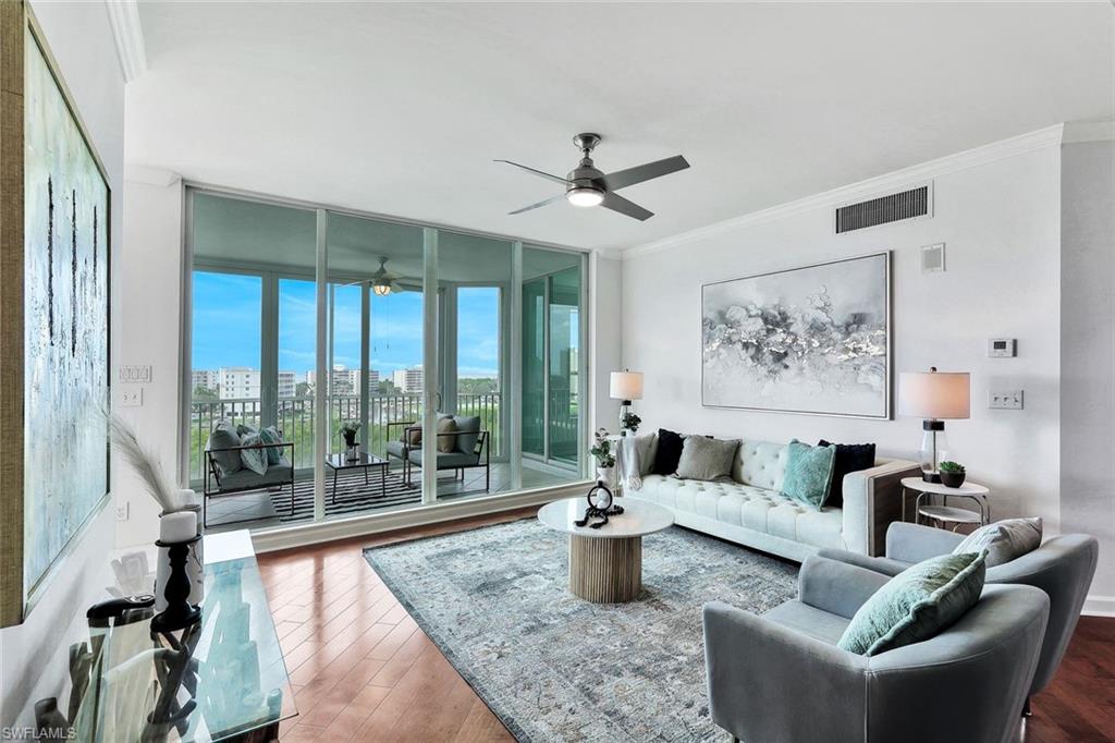 300 Dunes Boulevard, Unit 605 Naples, FL 34110 - Photo 3 of 37 a living room with furniture and a large window
