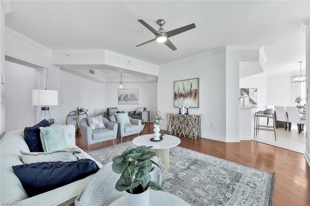 300 Dunes Boulevard, Unit 605 Naples, FL 34110 - Photo 4 of 37 a living room with furniture and wooden floor