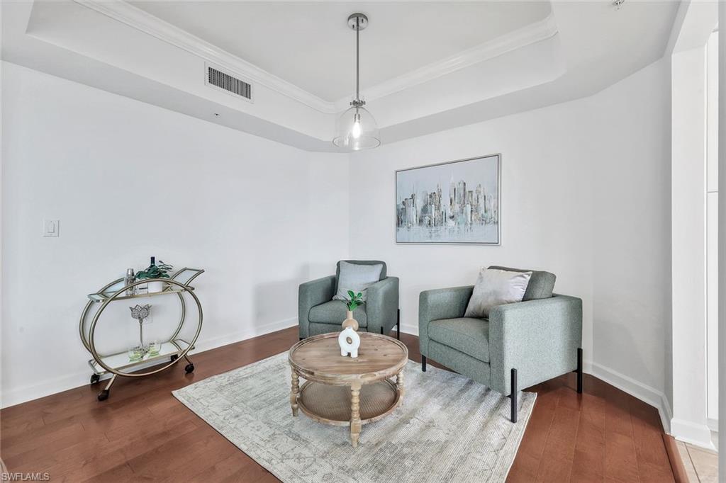 300 Dunes Boulevard, Unit 605 Naples, FL 34110 - Photo 6 of 37 a living room with furniture and a wooden floor