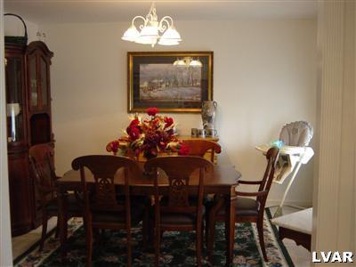 945 Renaldi Road Wind Gap, PA 18091 - Photo 15 of 23 a view of a dining room with furniture and chandelier