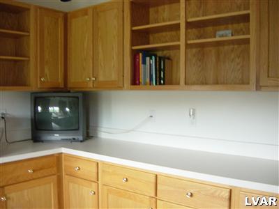 945 Renaldi Road Wind Gap, PA 18091 - Photo 19 of 23 a kitchen with a sink and cabinets