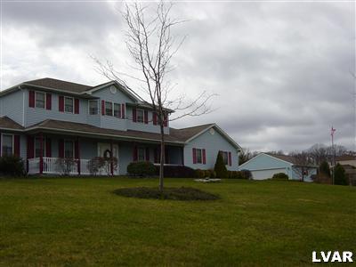 945 Renaldi Road Wind Gap, PA 18091 - Photo 8 of 23 a front view of a house with garden
