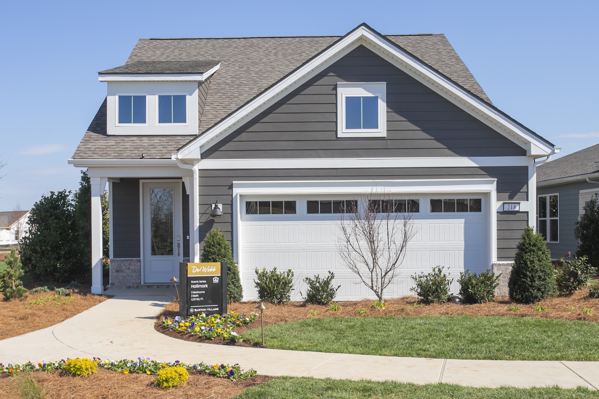 a front view of a house with garden