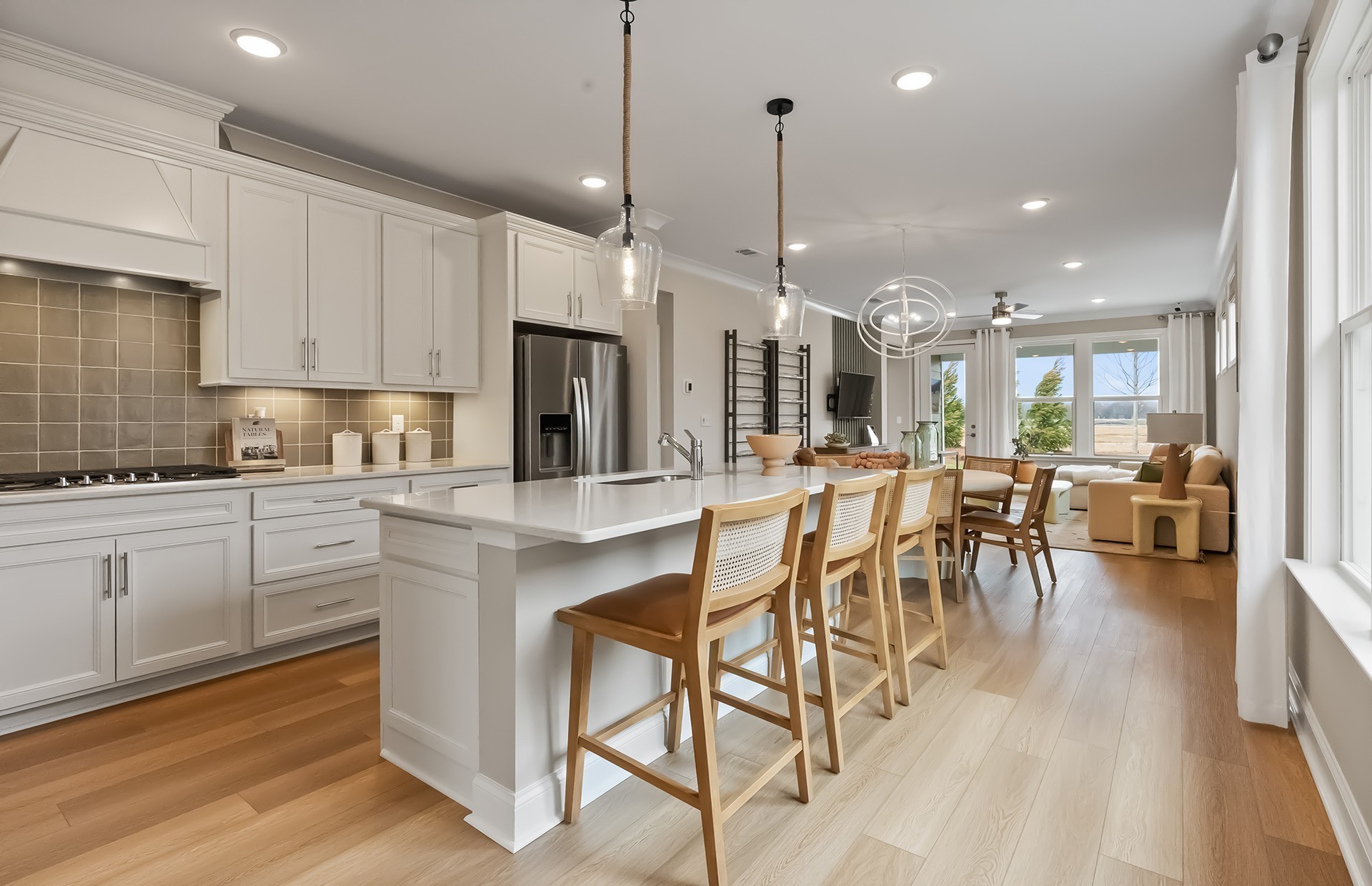 511 Scarlet Oak Road Lebanon, TN 37090 - Photo 3 of 32 a kitchen with stainless steel appliances kitchen island granite countertop a table chairs and a view of living room