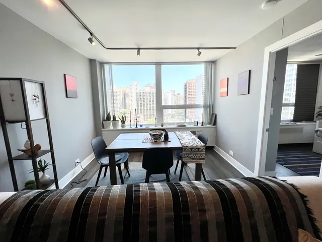 a bedroom with a bed and a table in it