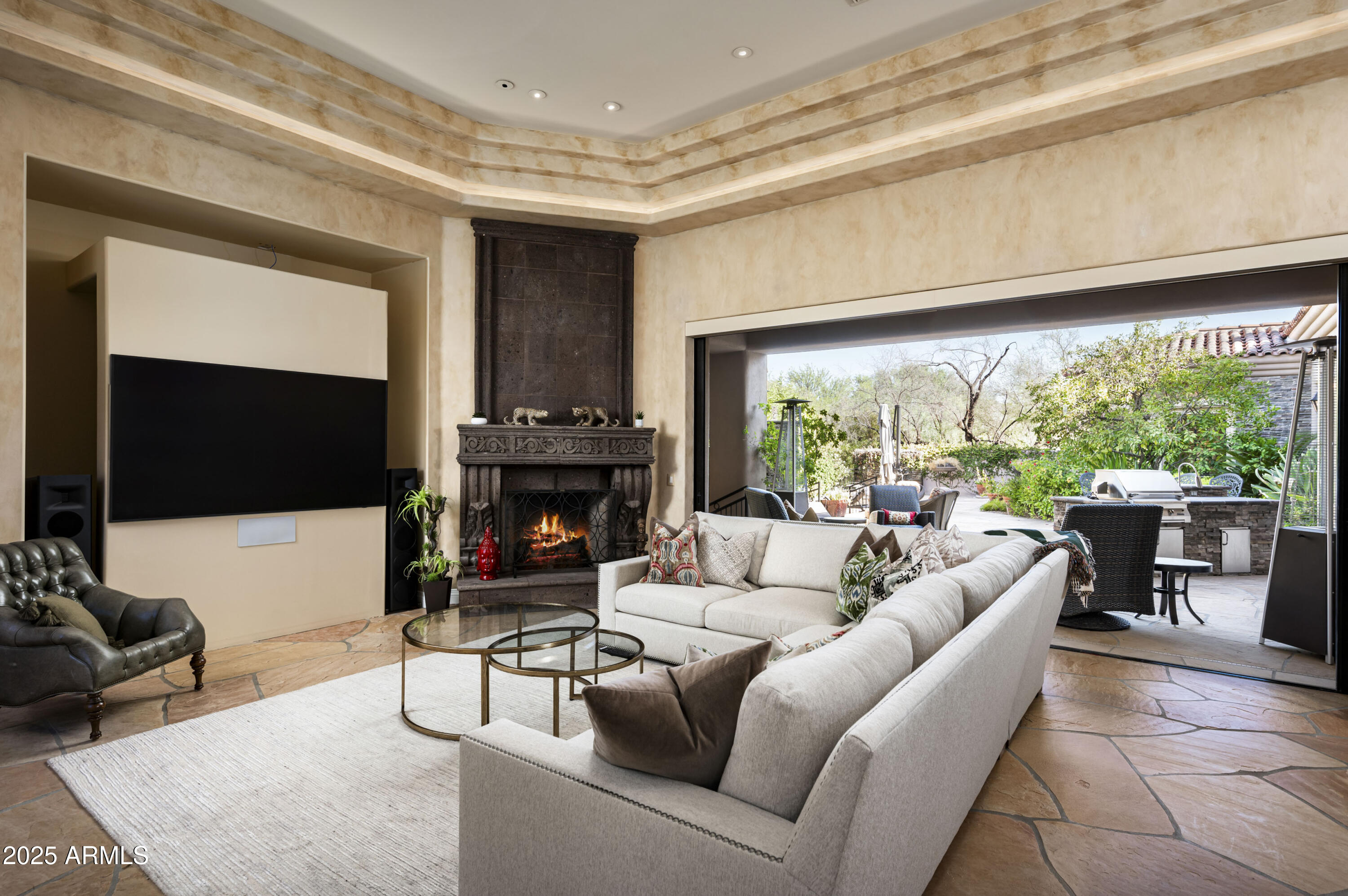 8150 North Ridgeview Drive Paradise Valley, AZ 85253 - Photo 11 of 37 a living room with furniture a fireplace and a large window