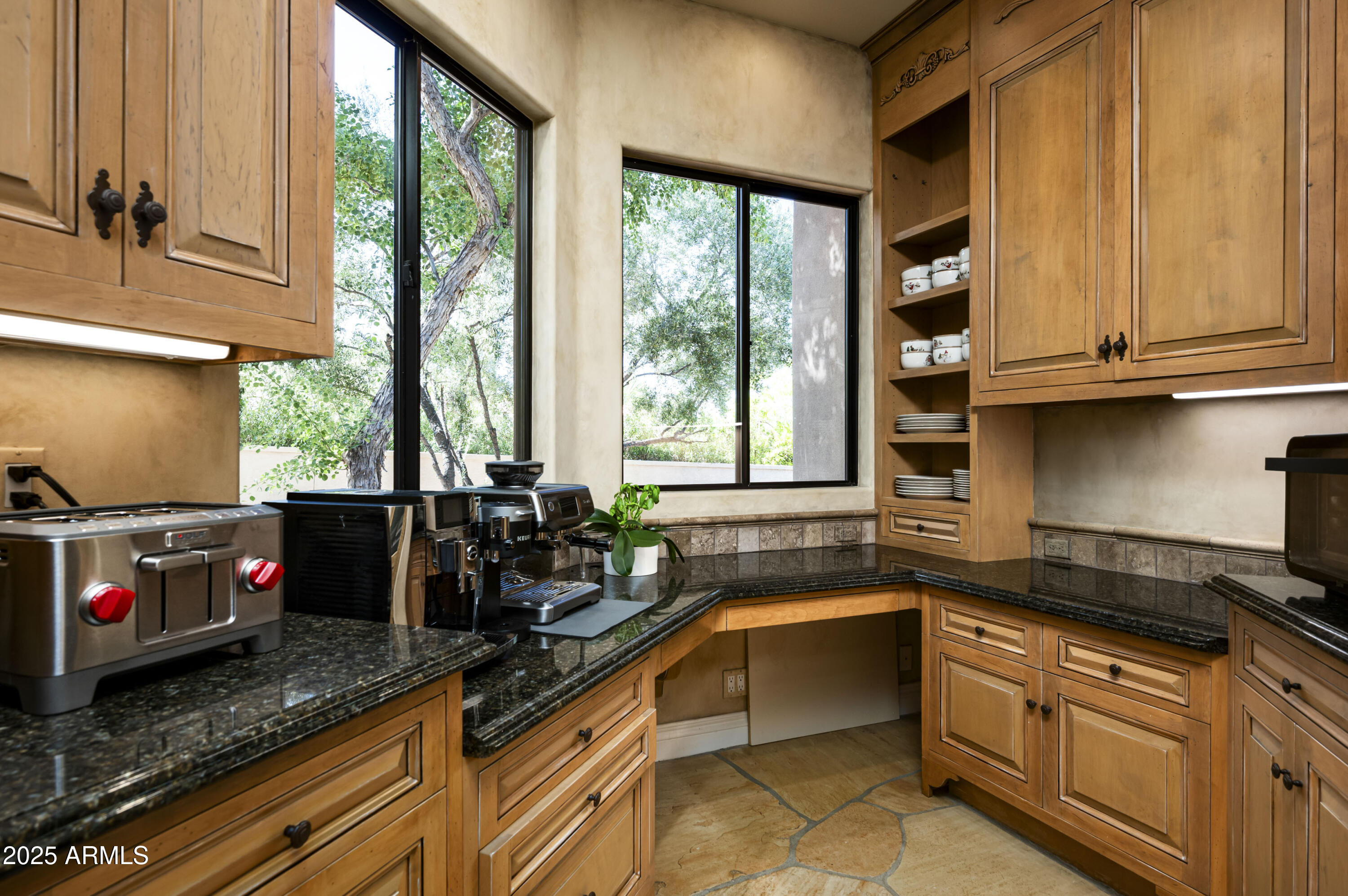 8150 North Ridgeview Drive Paradise Valley, AZ 85253 - Photo 14 of 37 a kitchen with granite countertop a stove a sink and a granite counter tops
