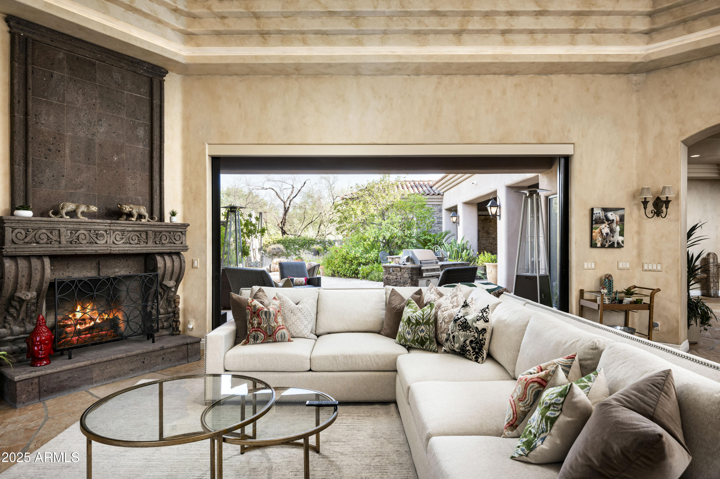 8150 North Ridgeview Drive Paradise Valley, AZ 85253 - Photo 2 of 37 a living room with furniture and a fireplace