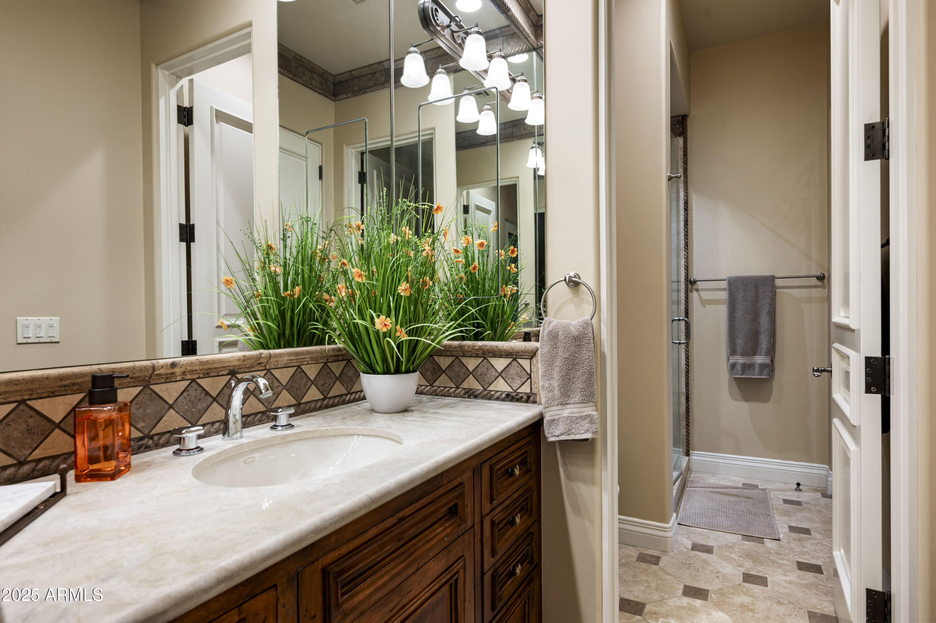 8150 North Ridgeview Drive Paradise Valley, AZ 85253 - Photo 23 of 37 a bathroom with a granite countertop sink and a mirror