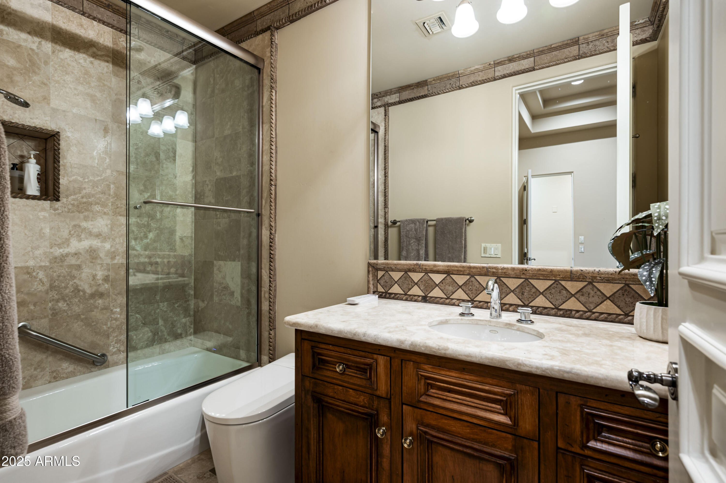 8150 North Ridgeview Drive Paradise Valley, AZ 85253 - Photo 25 of 37 a bathroom with a sink and a mirror