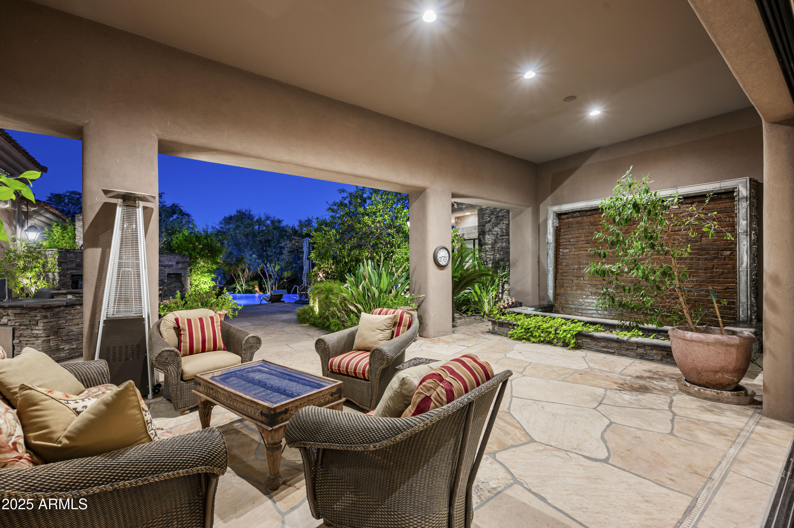 8150 North Ridgeview Drive Paradise Valley, AZ 85253 - Photo 3 of 37 a outdoor living space with furniture potted plant and a garden