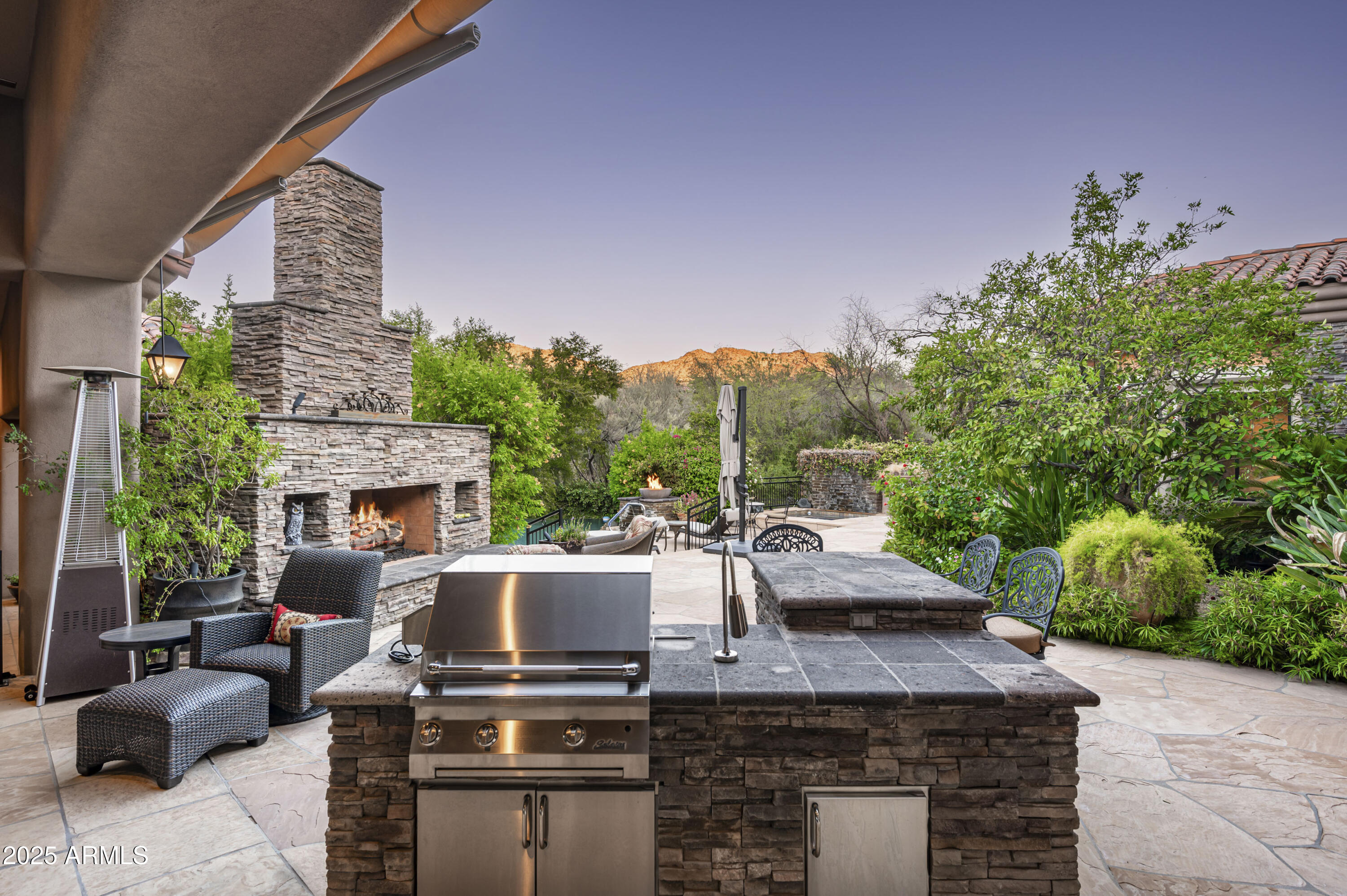 8150 North Ridgeview Drive Paradise Valley, AZ 85253 - Photo 33 of 37 a view of a patio with couches table and chairs and potted plants