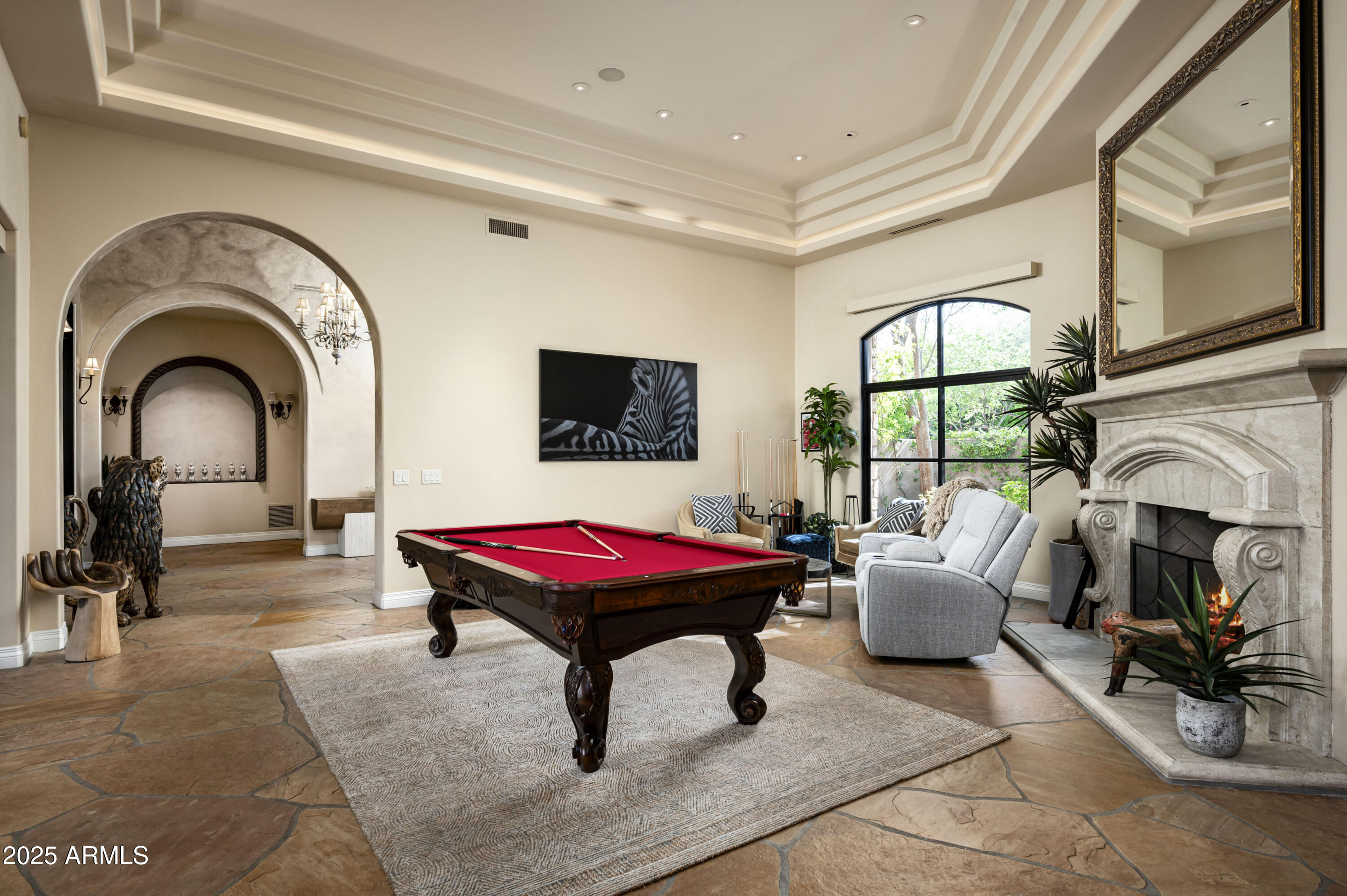8150 North Ridgeview Drive Paradise Valley, AZ 85253 - Photo 8 of 37 a living room with furniture a fireplace and flat screen tv