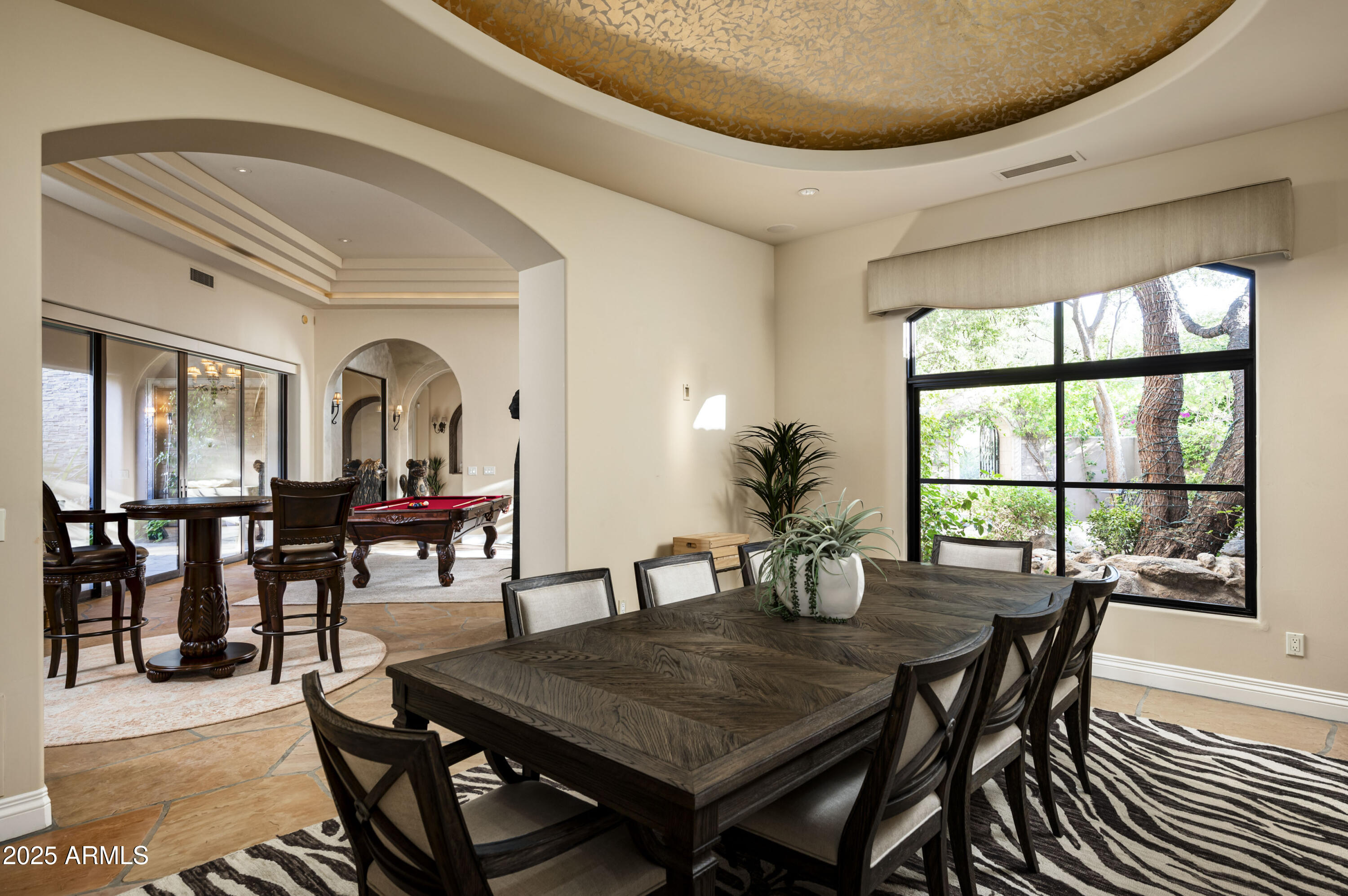 8150 North Ridgeview Drive Paradise Valley, AZ 85253 - Photo 10 of 37 a view of a dining room and livingroom with furniture window and wooden floor