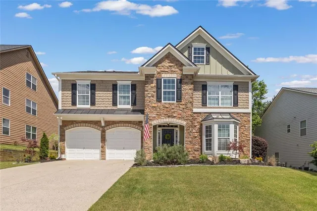 a front view of a house with a yard