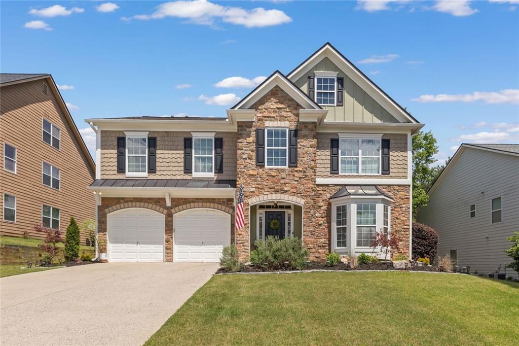 a front view of a house with a yard