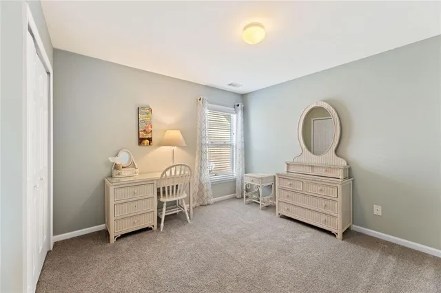 a bedroom with bed and a window