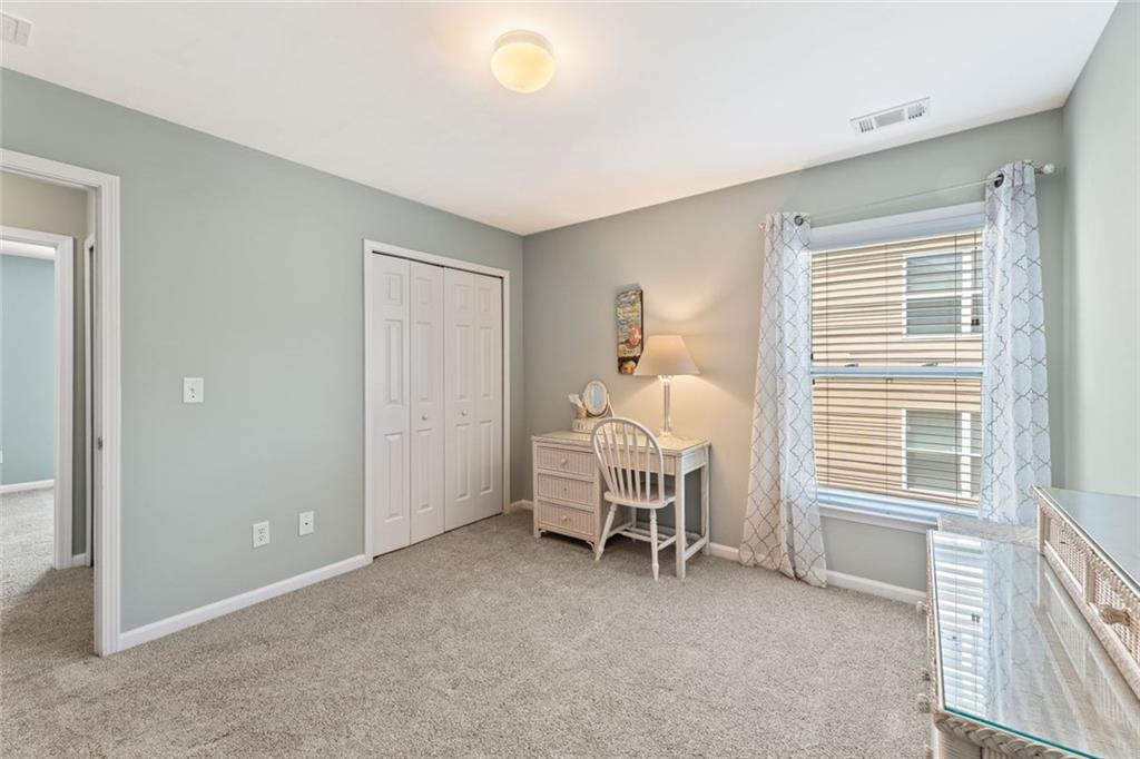 5415 Fieldfreen Drive Cumming, GA 30028 - Photo 21 of 40 a view of a livingroom with a chair and dining table
