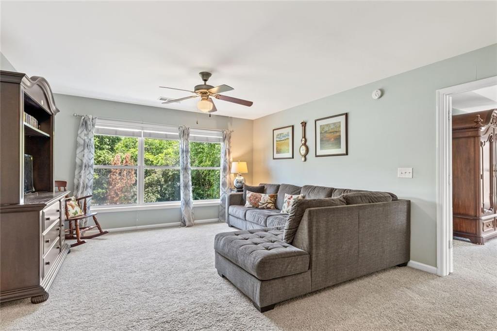5415 Fieldfreen Drive Cumming, GA 30028 - Photo 26 of 40 a living room with furniture and a flat screen tv