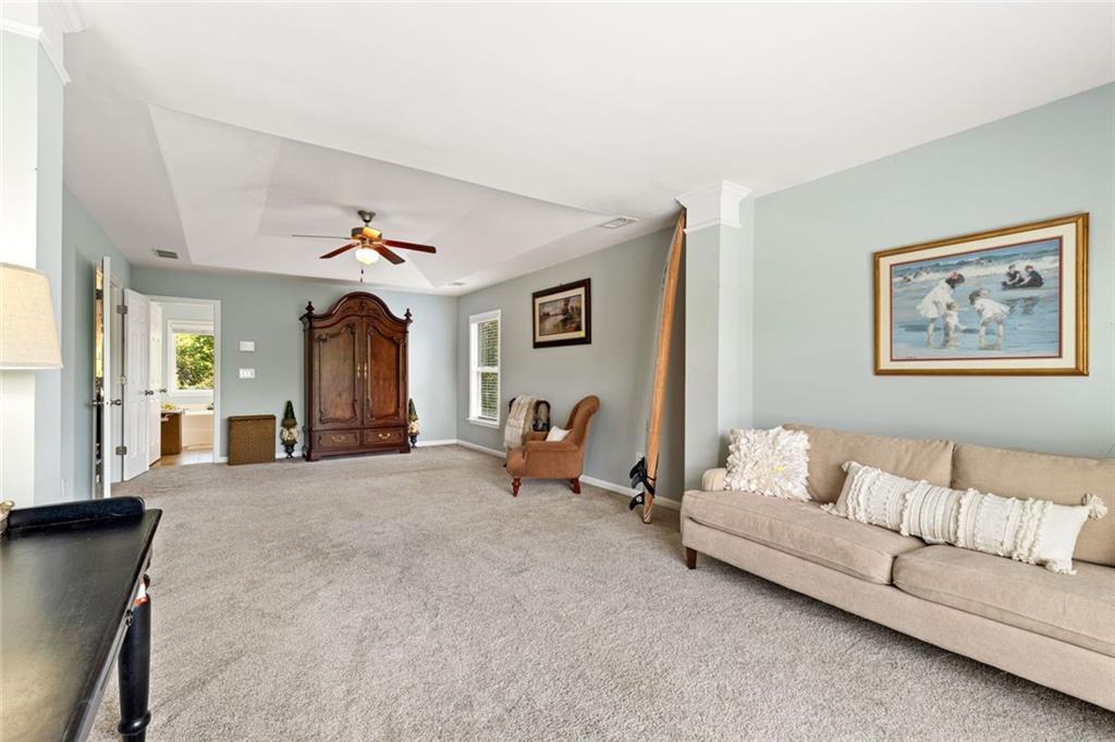 5415 Fieldfreen Drive Cumming, GA 30028 - Photo 30 of 40 a living room with furniture and a table
