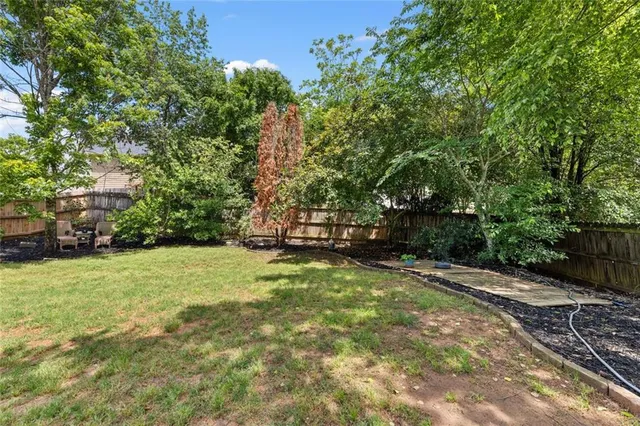 a view of a field with trees