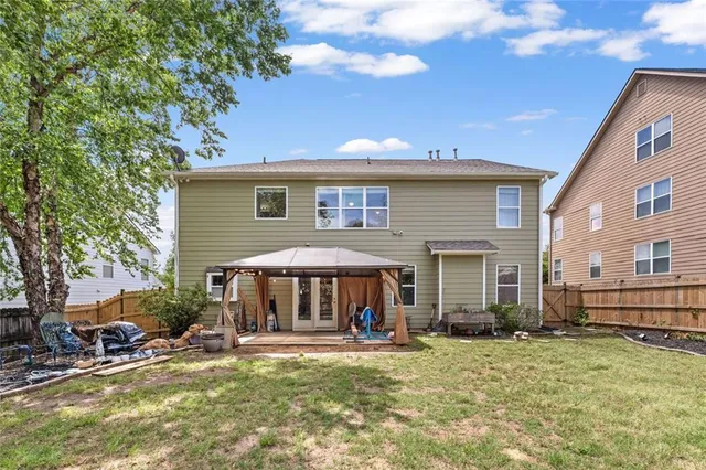 a backyard of a house with lots of green space