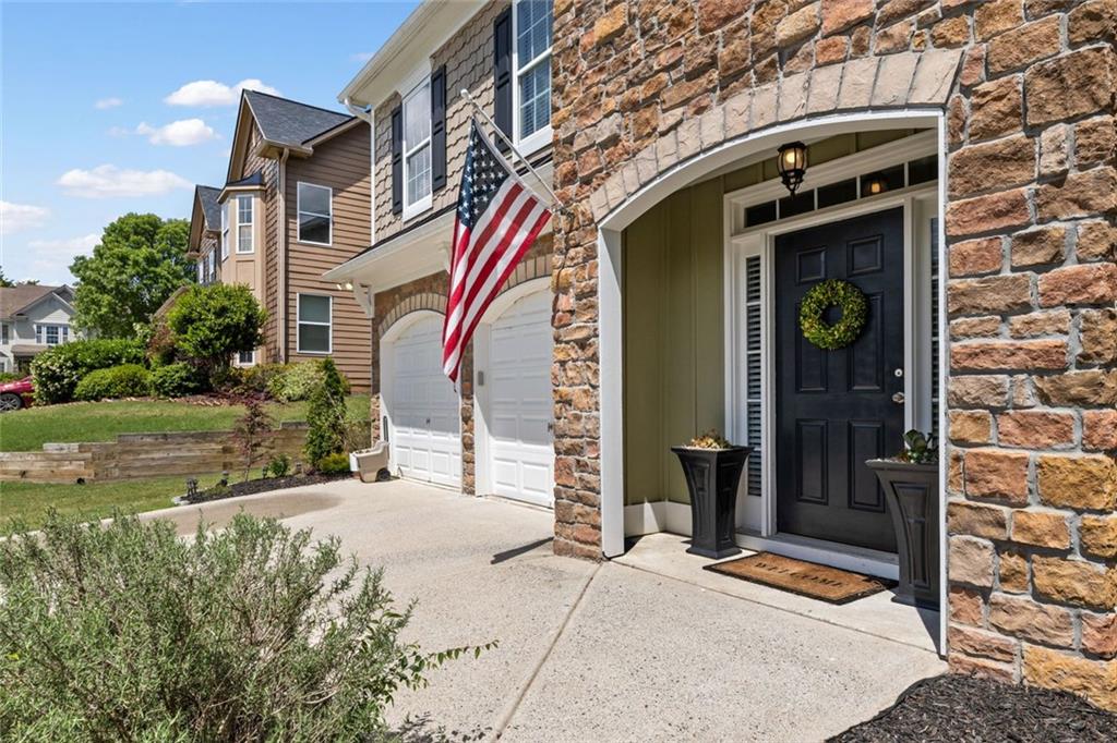 5415 Fieldfreen Drive Cumming, GA 30028 - Photo 4 of 40 a front view of a building with a garden