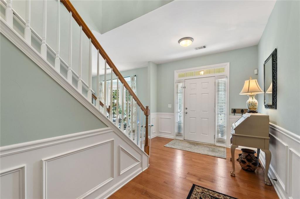 5415 Fieldfreen Drive Cumming, GA 30028 - Photo 5 of 40 a view of entryway and hall with wooden floor
