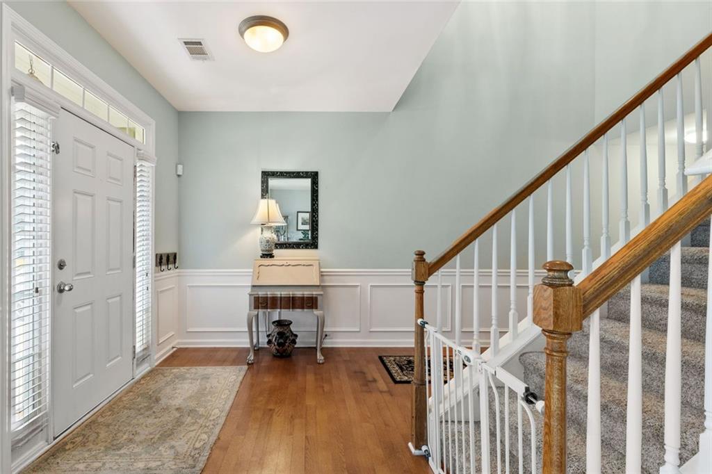 5415 Fieldfreen Drive Cumming, GA 30028 - Photo 6 of 40 a view of a livingroom with wooden floor and stairs