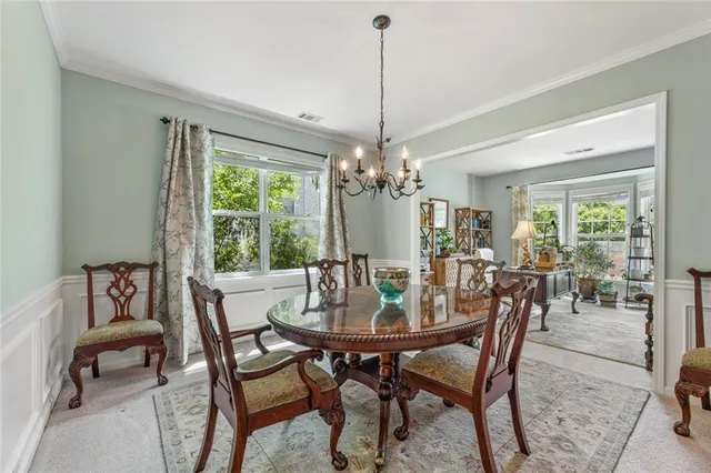 a view of a dining room with furniture window and outside view