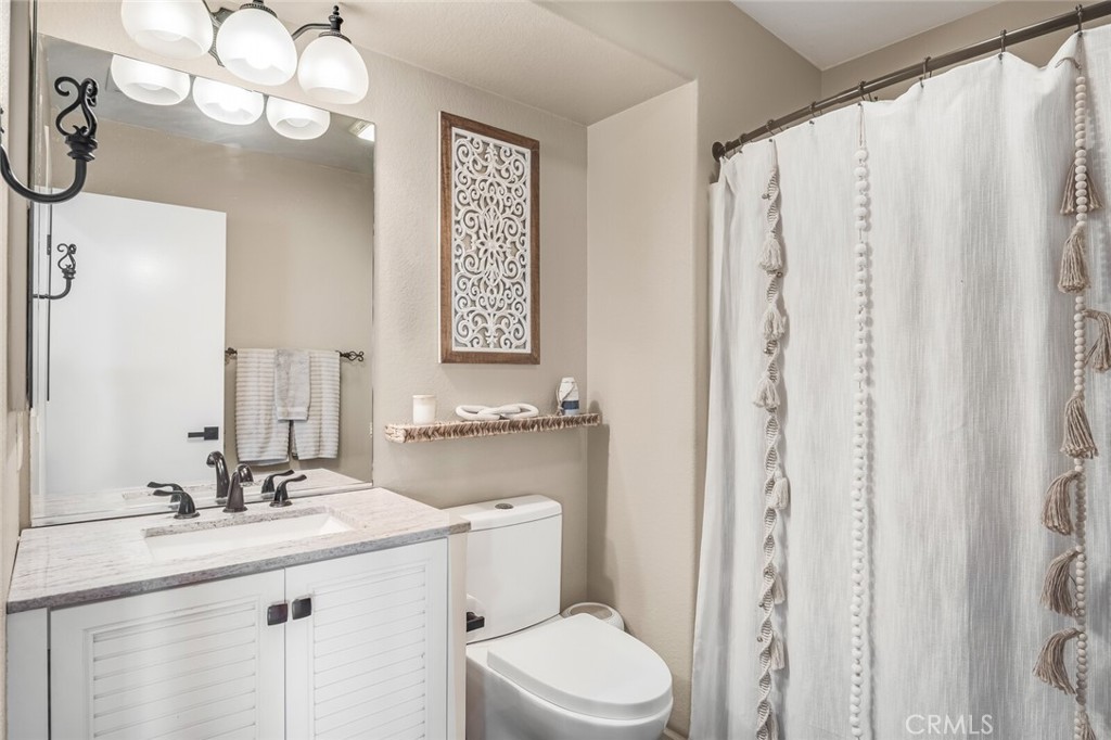 4330 Forest Ranch Way Oceanside, CA 92057 - Photo 19 of 51 The full bath is complete with a custom vanity, upgraded toilet, and tub/shower combo, ideal for guests or multigenerational living.