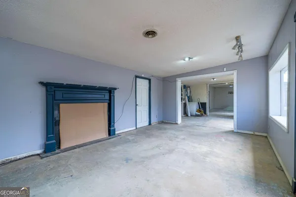 a view of a bathroom with a tub and shower