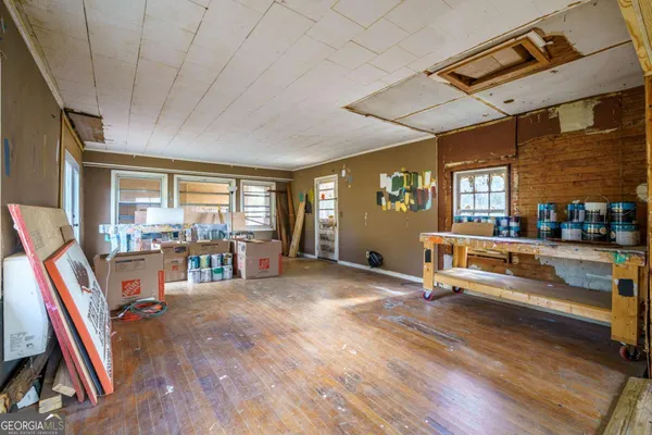 a living room with furniture and a table