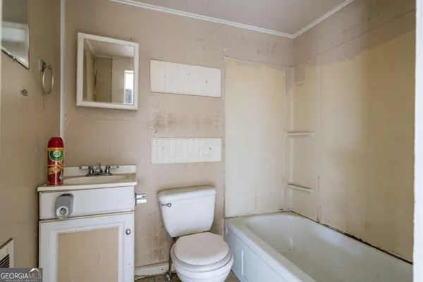 a bathroom with a toilet and a sink