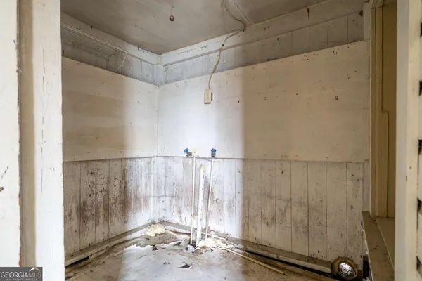 a view of an empty room and fire place
