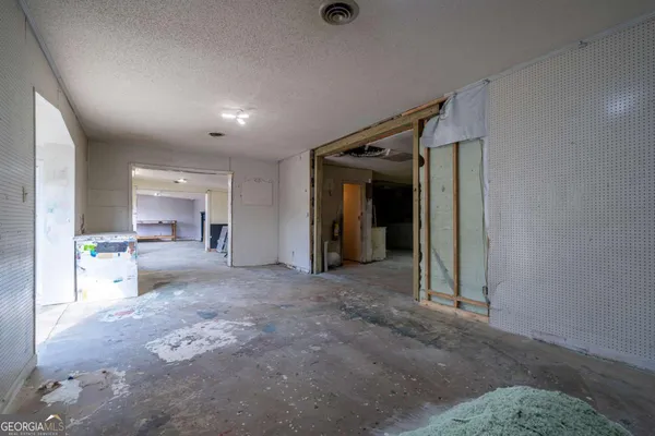 a view of a hallway with seating area