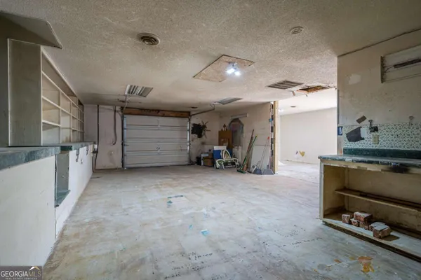 a view of storage and utility room with racks on the wall