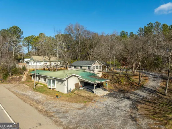 a view of a house with a snow in the yard