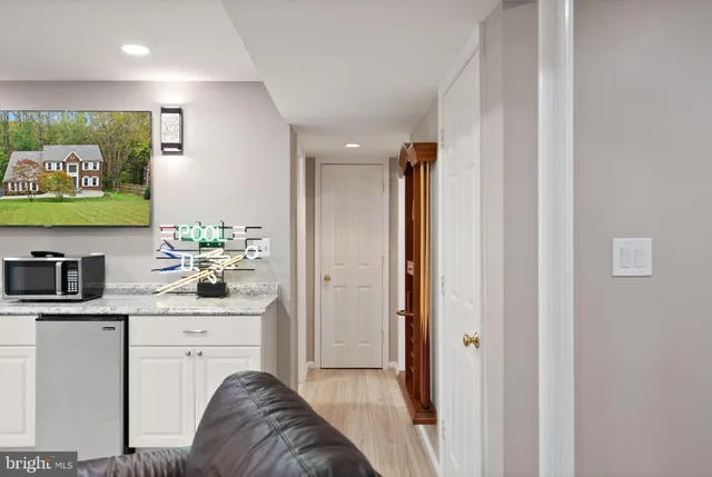 a view of hallway with wooden floor