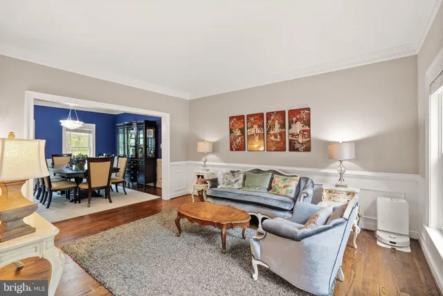 a living room with furniture and a rug