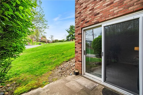 a view of front door of house with stairs